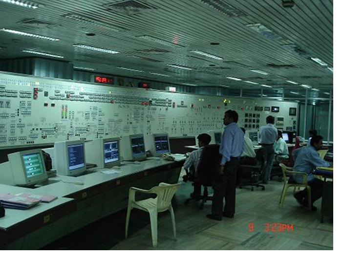 Operators at the DCS consoles of a 500 MW unit control room
